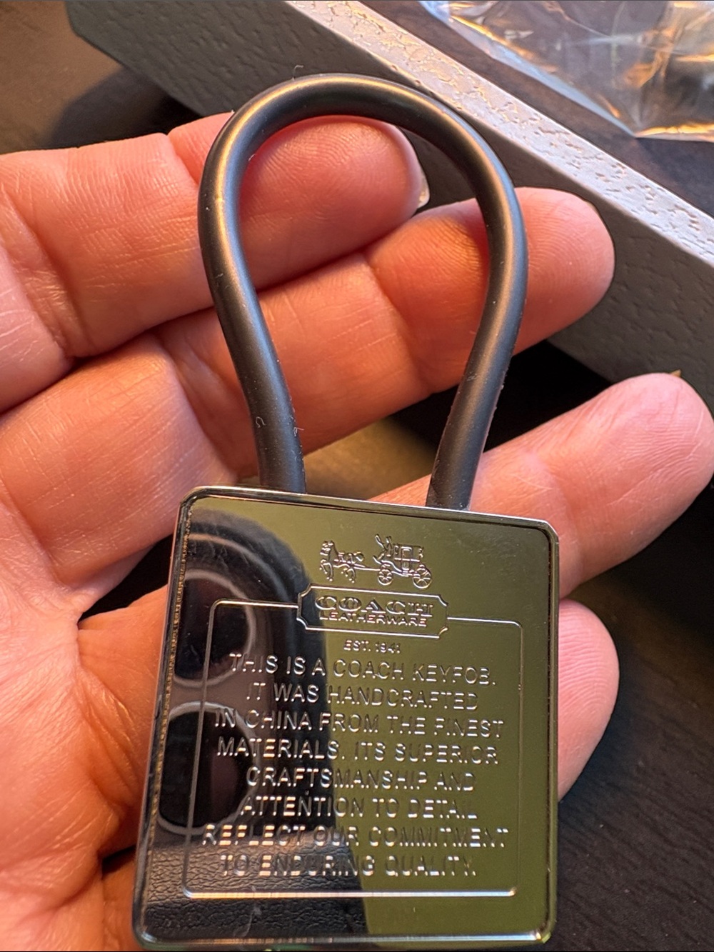 Coach Silver Creed Keychain with Black Pen.